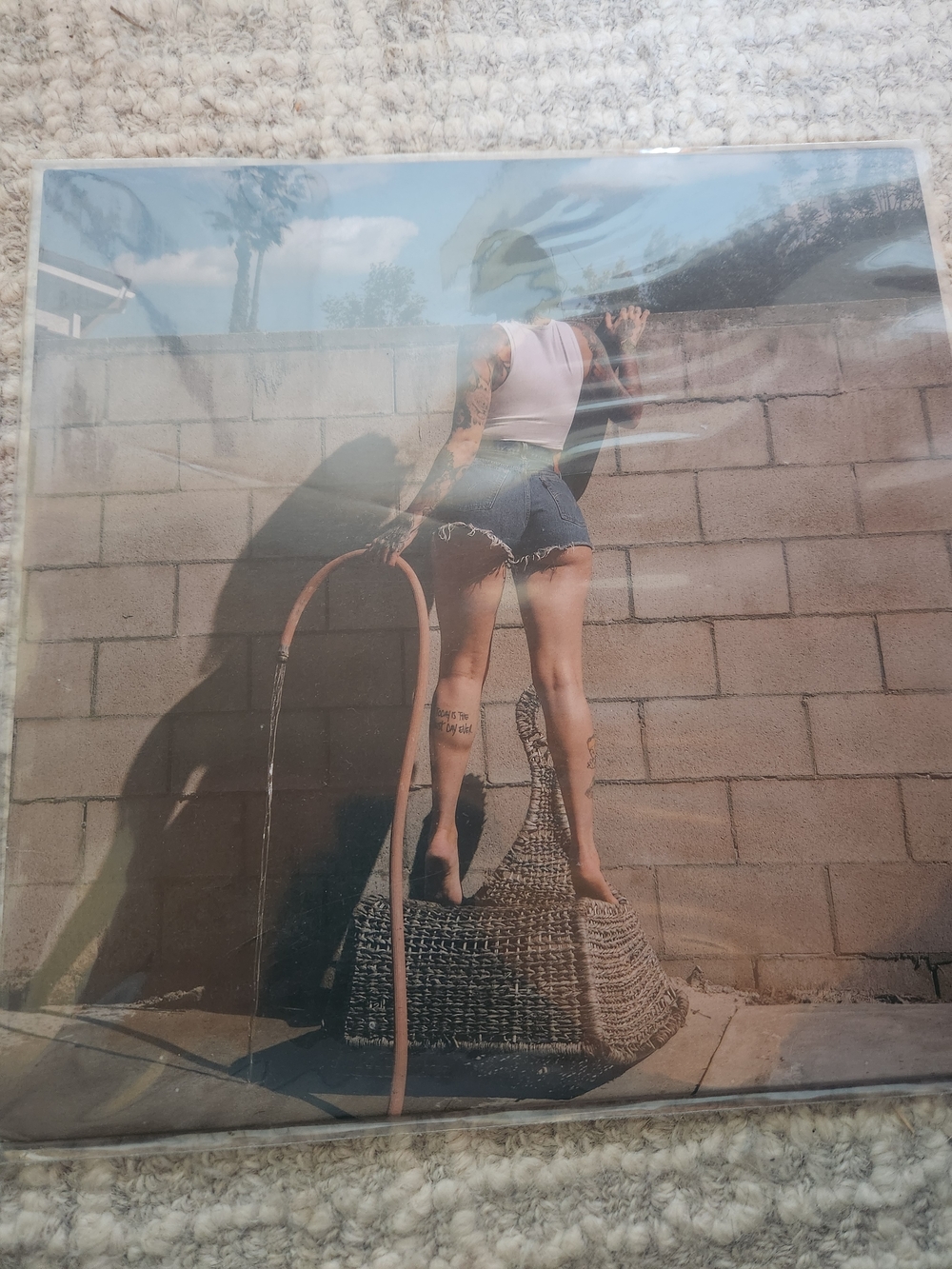 Photo Print of Woman in White Tank and Denim Shorts